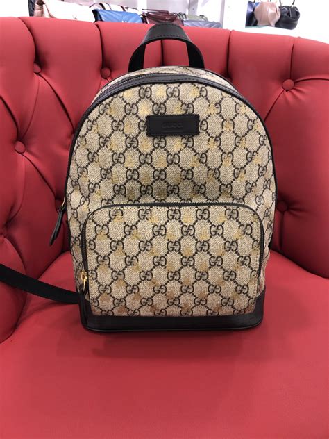 black gucci backpack with bee